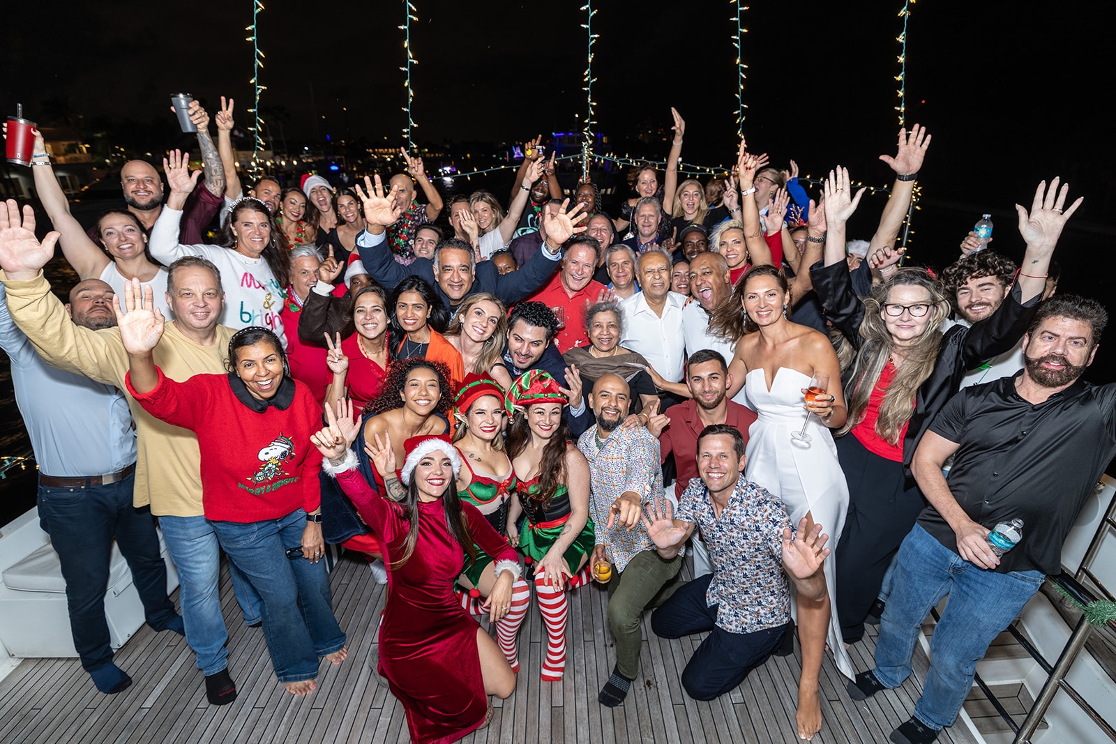 Sponsors, friends, and performers aboard Troca One during the 2025 Hard Rock Winterfest Boat Parade in Fort Lauderdale